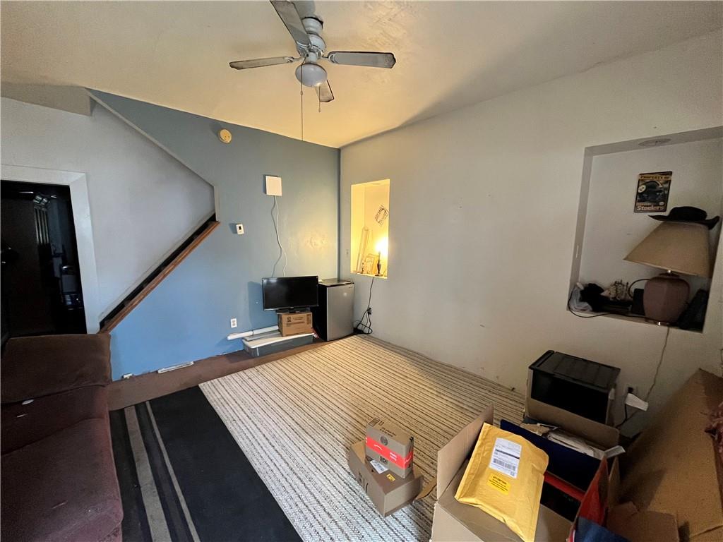 5154-5158 Natrona Way Pittsburgh, PA 15201 - Photo 22 of 46 a bedroom with a bed and wooden floor