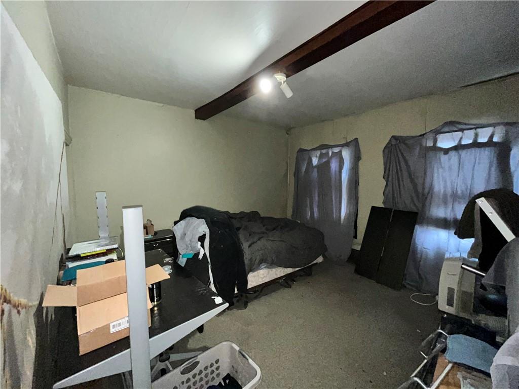 5154-5158 Natrona Way Pittsburgh, PA 15201 - Photo 25 of 46 a bedroom with a bed and furniture