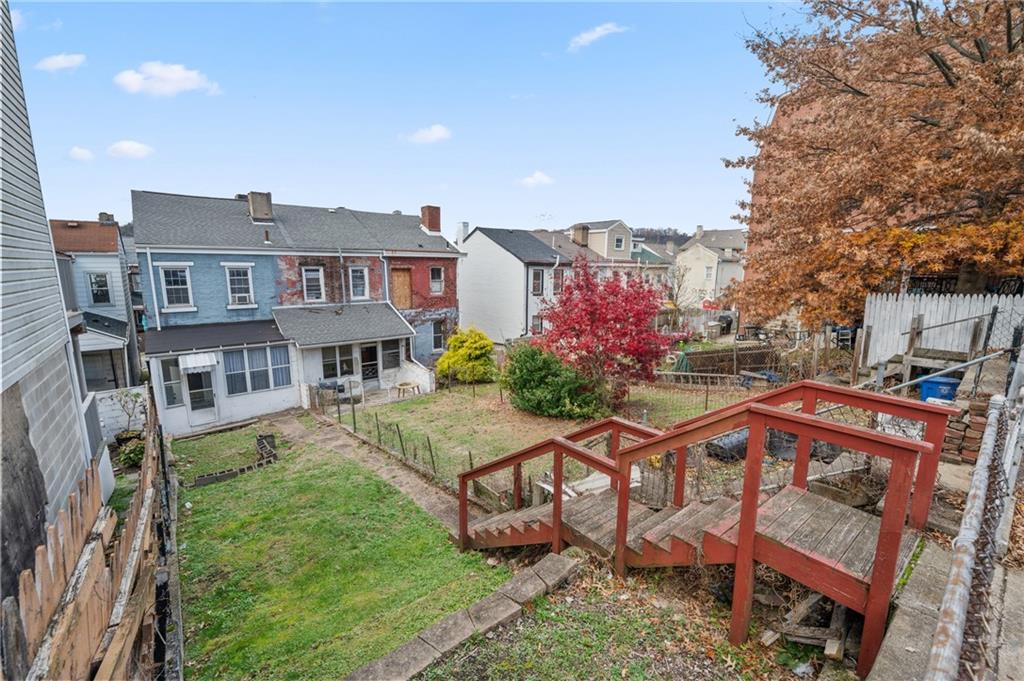 5154-5158 Natrona Way Pittsburgh, PA 15201 - Photo 3 of 46 a view of a house with a yard and sitting area