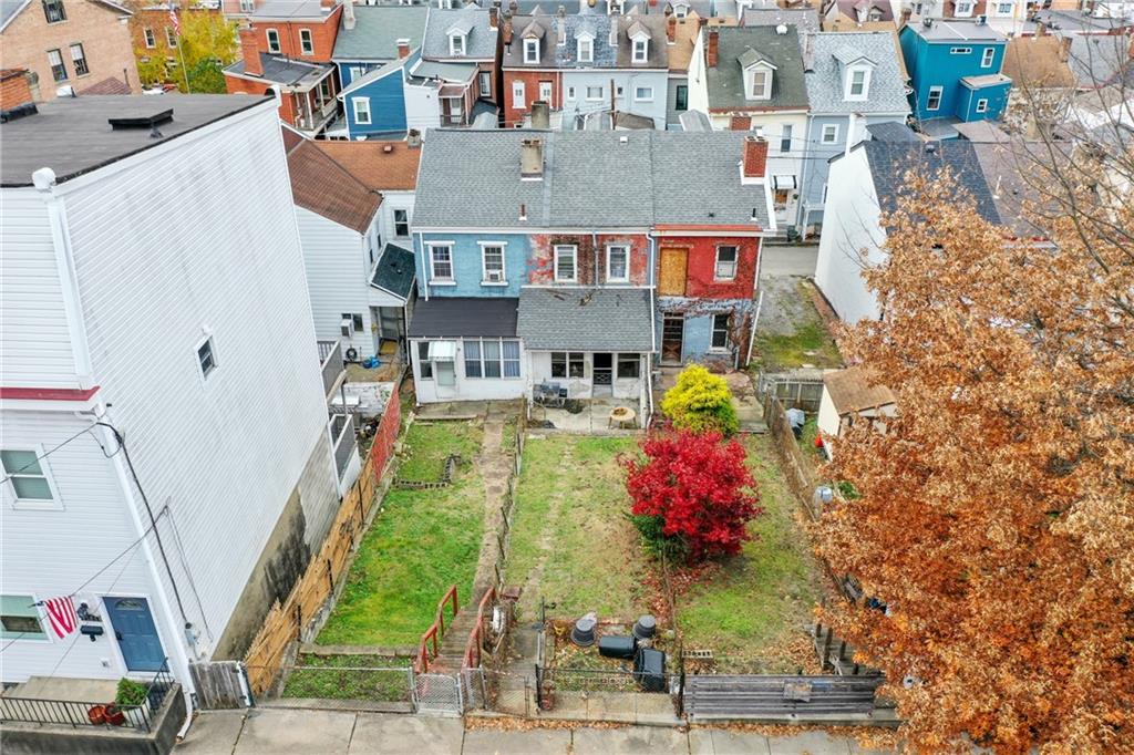 5154-5158 Natrona Way Pittsburgh, PA 15201 - Photo 4 of 46 a aerial view of a house with swimming pool and large trees