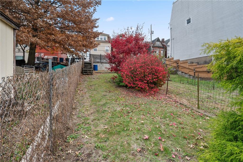5154-5158 Natrona Way Pittsburgh, PA 15201 - Photo 45 of 46 a backyard of a house with lots of green space