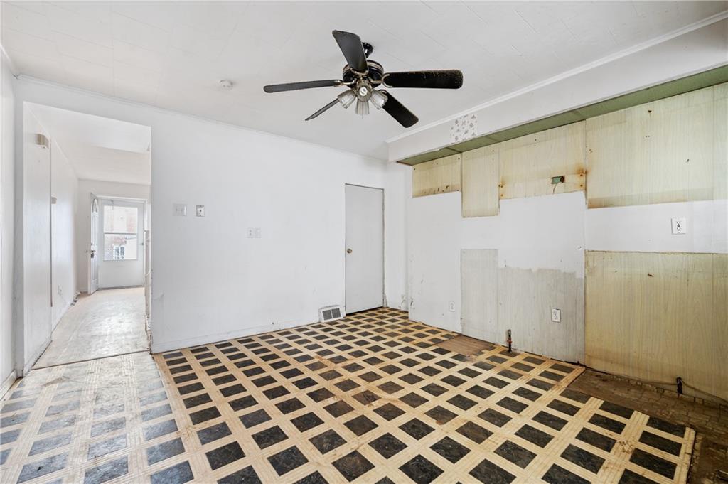 5154-5158 Natrona Way Pittsburgh, PA 15201 - Photo 10 of 46 a bedroom with a bed and a mirror