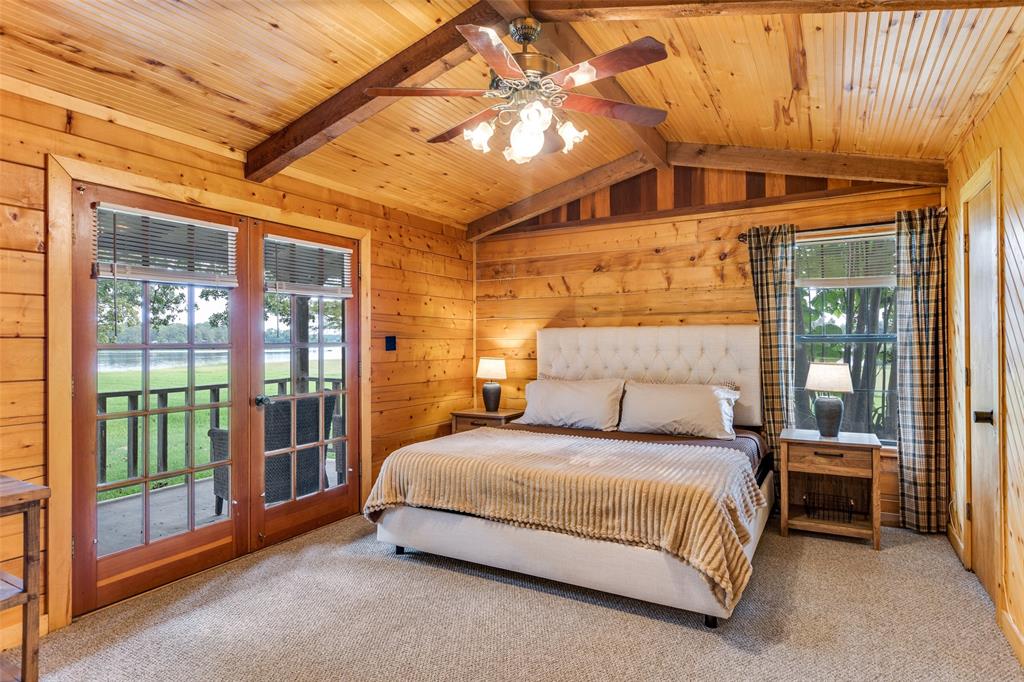 779 County Road 1971 Yantis, TX 75497 - Photo 21 of 40 a bedroom with a bed and a large window