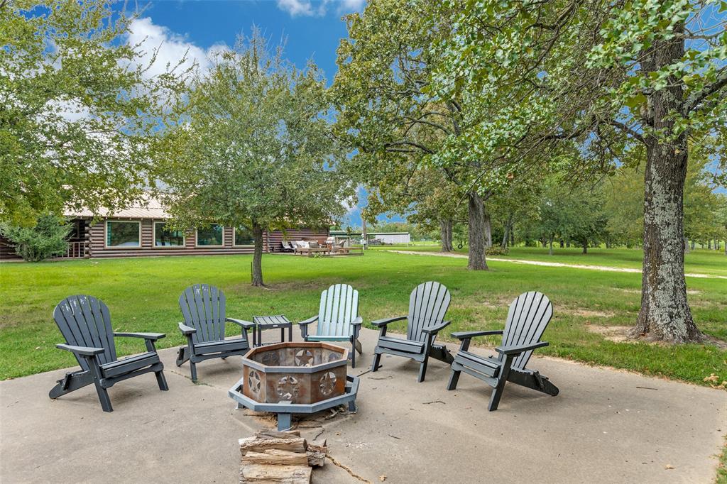 779 County Road 1971 Yantis, TX 75497 - Photo 33 of 40 a view of a chairs and table in backyard of the house