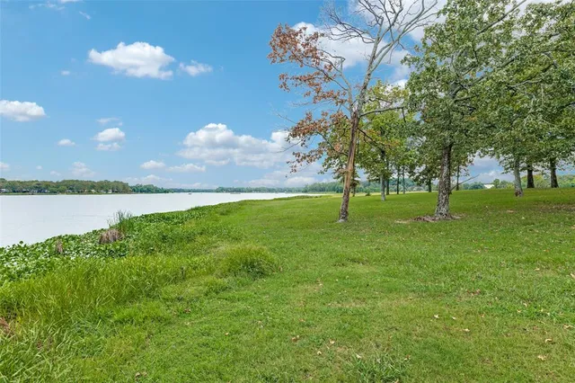a view of a golf course with a lake view