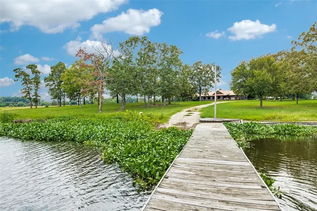 a view of swimming pool with a yard