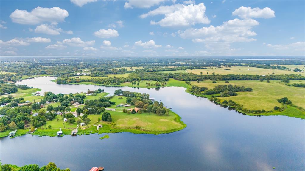 779 County Road 1971 Yantis, TX 75497 - Photo 38 of 40 a view of a lake with a mountain