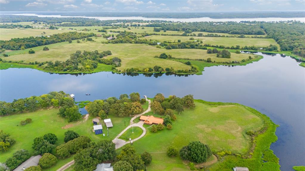 779 County Road 1971 Yantis, TX 75497 - Photo 40 of 40 a view of a lake with a houses