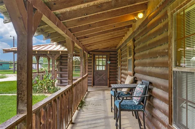 a view of a balcony with chairs