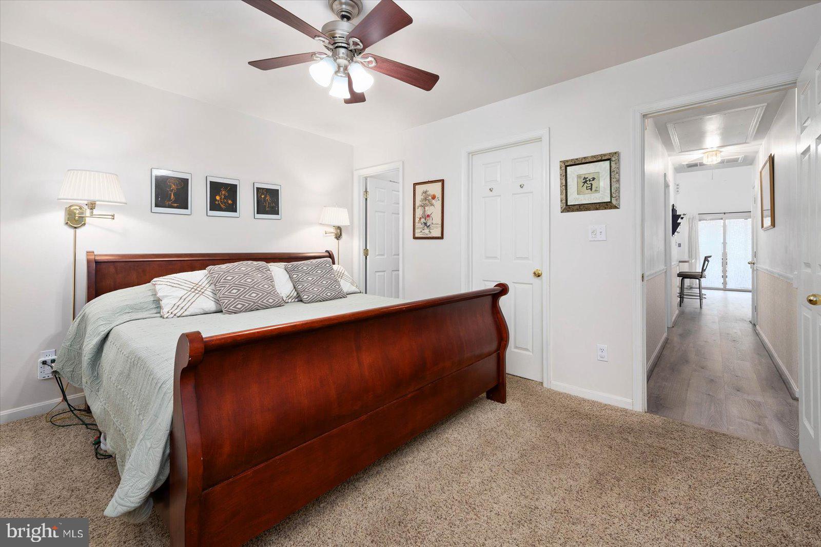 156 Sandyhook Road Berlin, MD 21811 - Photo 19 of 95 a bedroom with a bed and a chandelier