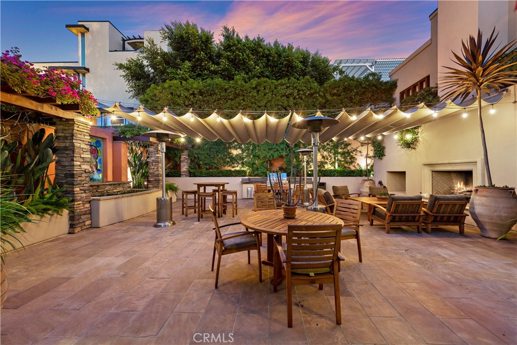 1603-1613 South Coast Highway, Unit F Laguna Beach, CA 92651 - Photo 35 of 38 The communal courtyard offers a bar, TV, barbecue, couches, fireplace, tables and chairs for resident gatherings or upscale private events.