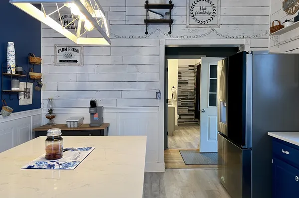 a kitchen with a sink and a refrigerator