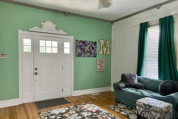a living room with furniture and a window