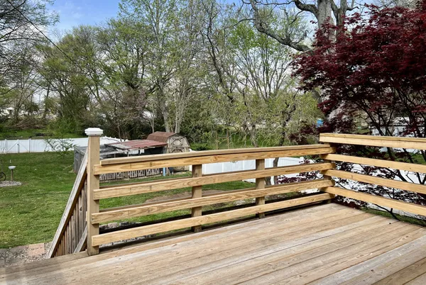 a view of a swimming pool with a yard