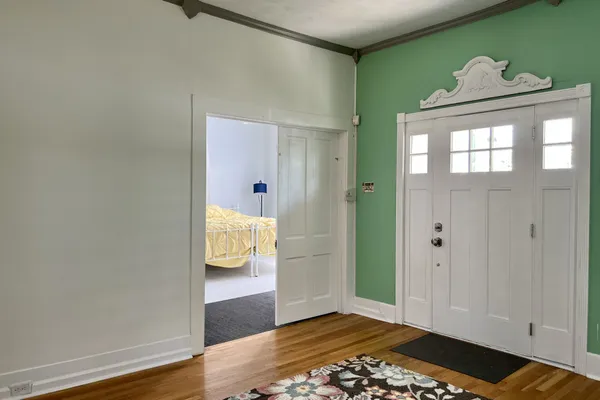 a view of entryway with wooden floor