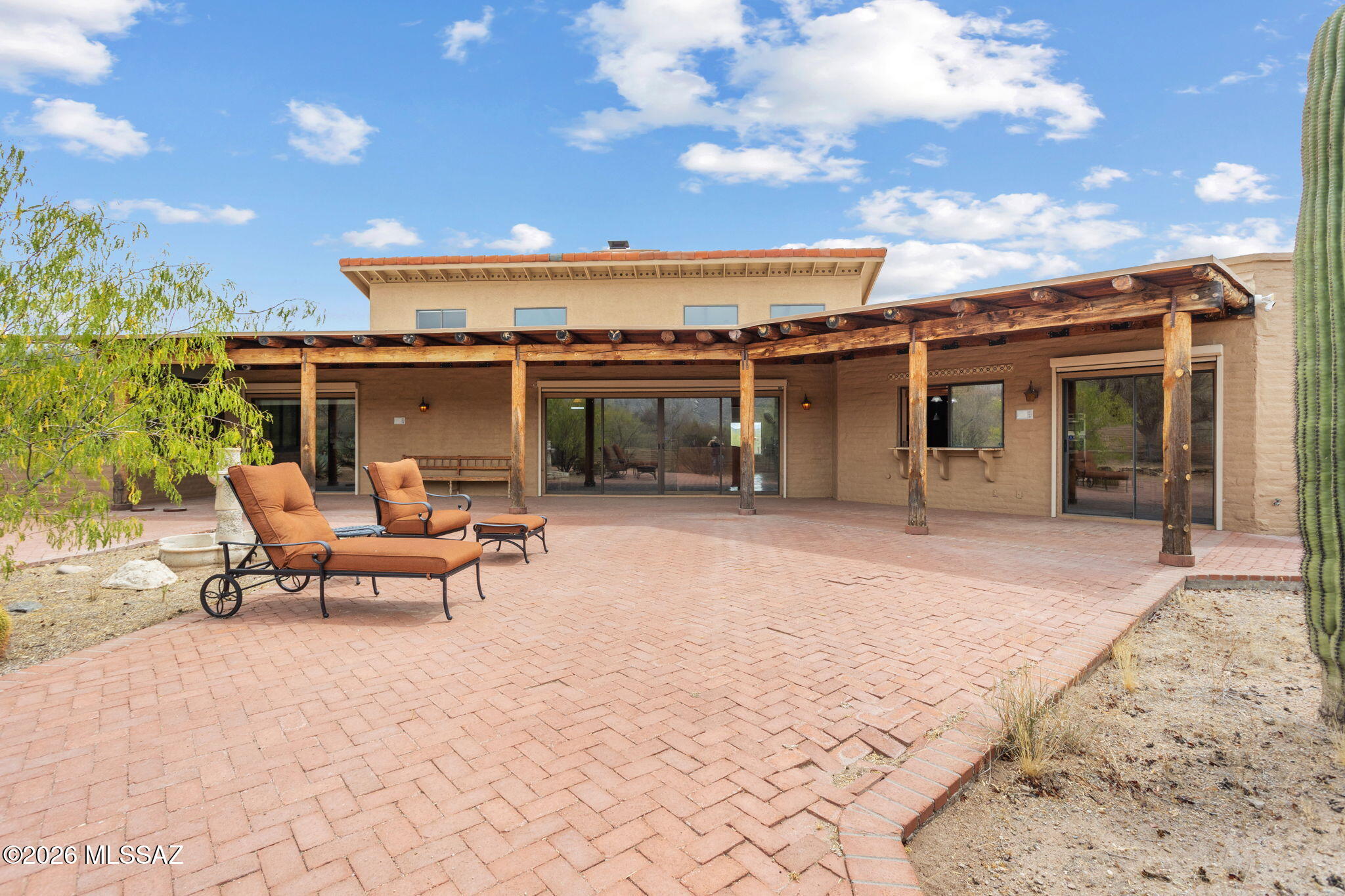7171 South X9 Ranch Road Vail, AZ 85641 - Photo 6 of 50 Loft and Living Room windows shown above patio. Chaises negotiable.