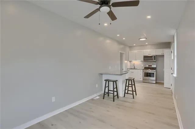 a kitchen with a table and chairs