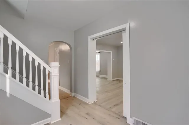 a view of an entryway with wooden floor