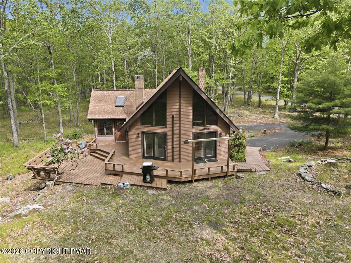1517 Deer Run East Bushkill, PA 18324 - Photo 34 of 42 a view of a small house with a yard