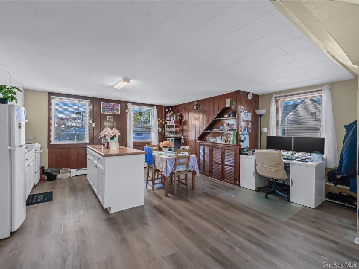 205 Lenox Road Huntington Station, NY 11746 - Photo 13 of 25 Office space with wooden walls, light wood-type flooring, and a baseboard radiator