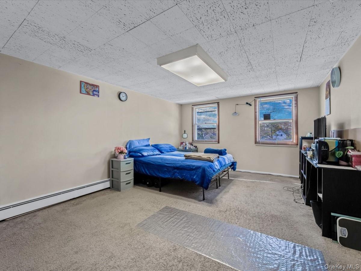 205 Lenox Road Huntington Station, NY 11746 - Photo 18 of 25 Carpeted bedroom with baseboards