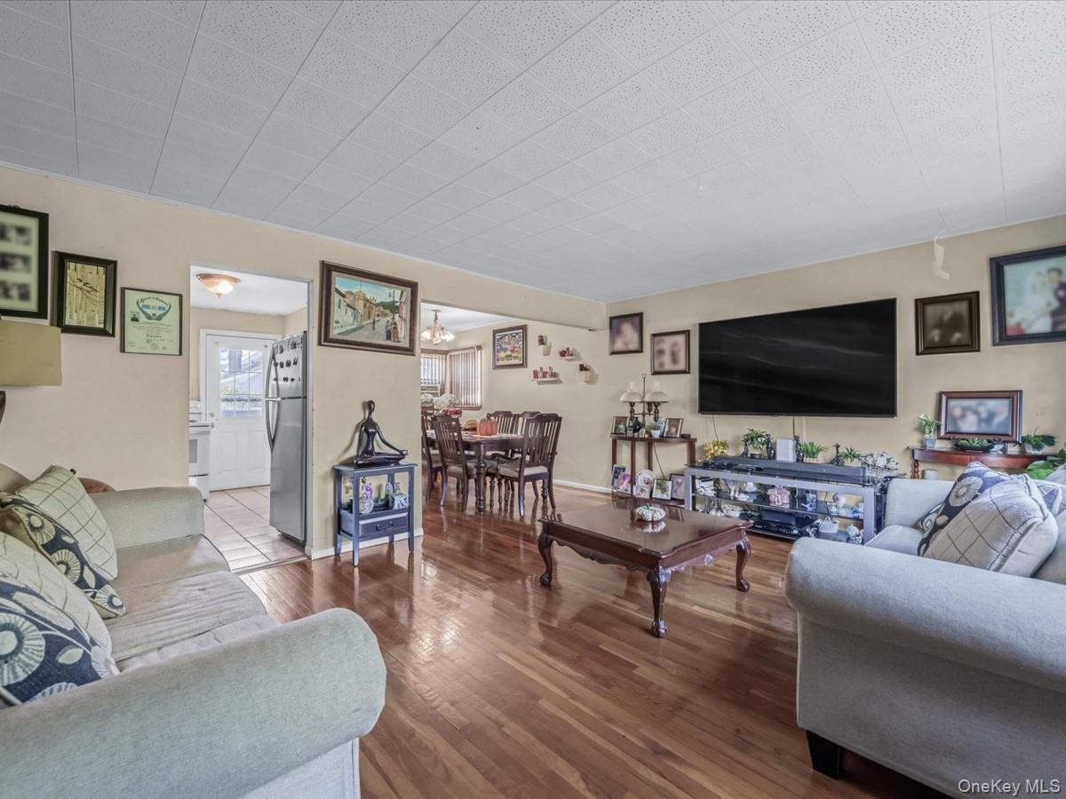 205 Lenox Road Huntington Station, NY 11746 - Photo 3 of 25 Living room featuring wood finished floors