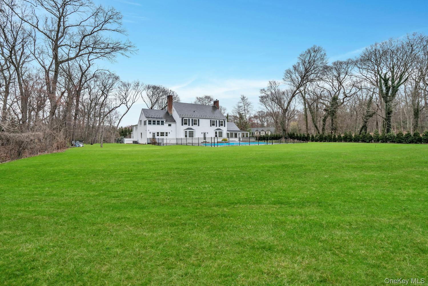 539 Split Rock Road Syosset, NY 11791 - Photo 34 of 40 View of yard with a fenced in pool and fence