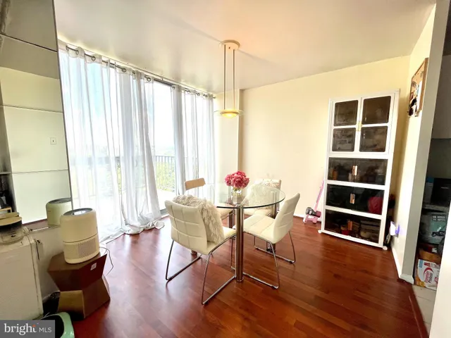 a view of a dining room with furniture and a window