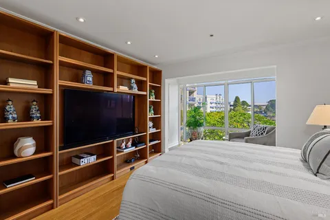 a room with furniture and a flat screen tv