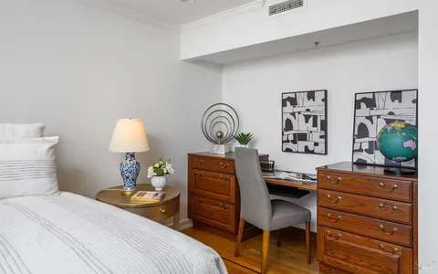 a spacious bathroom with a double vanity sink mirror and toilet