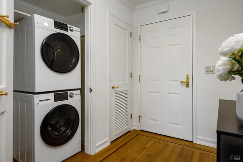 a view of a room with wooden floor