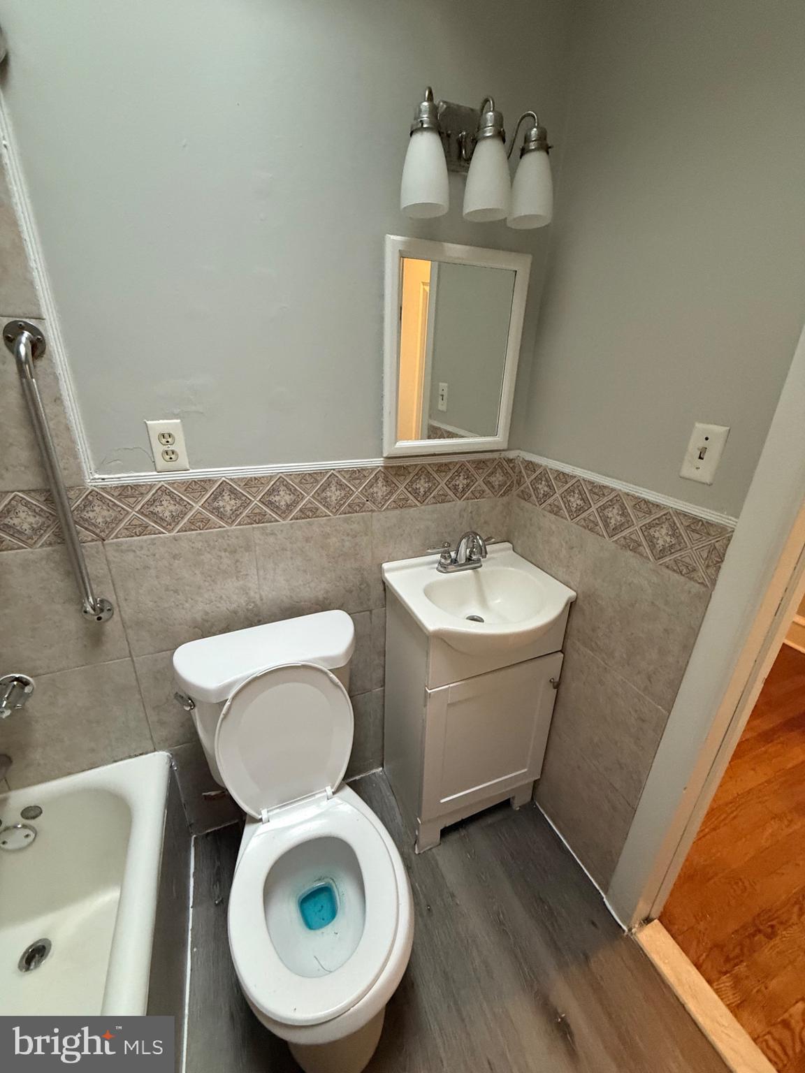 7249 Guilford Road Upper Darby, PA 19082 - Photo 10 of 19 a bathroom with a toilet sink and mirror