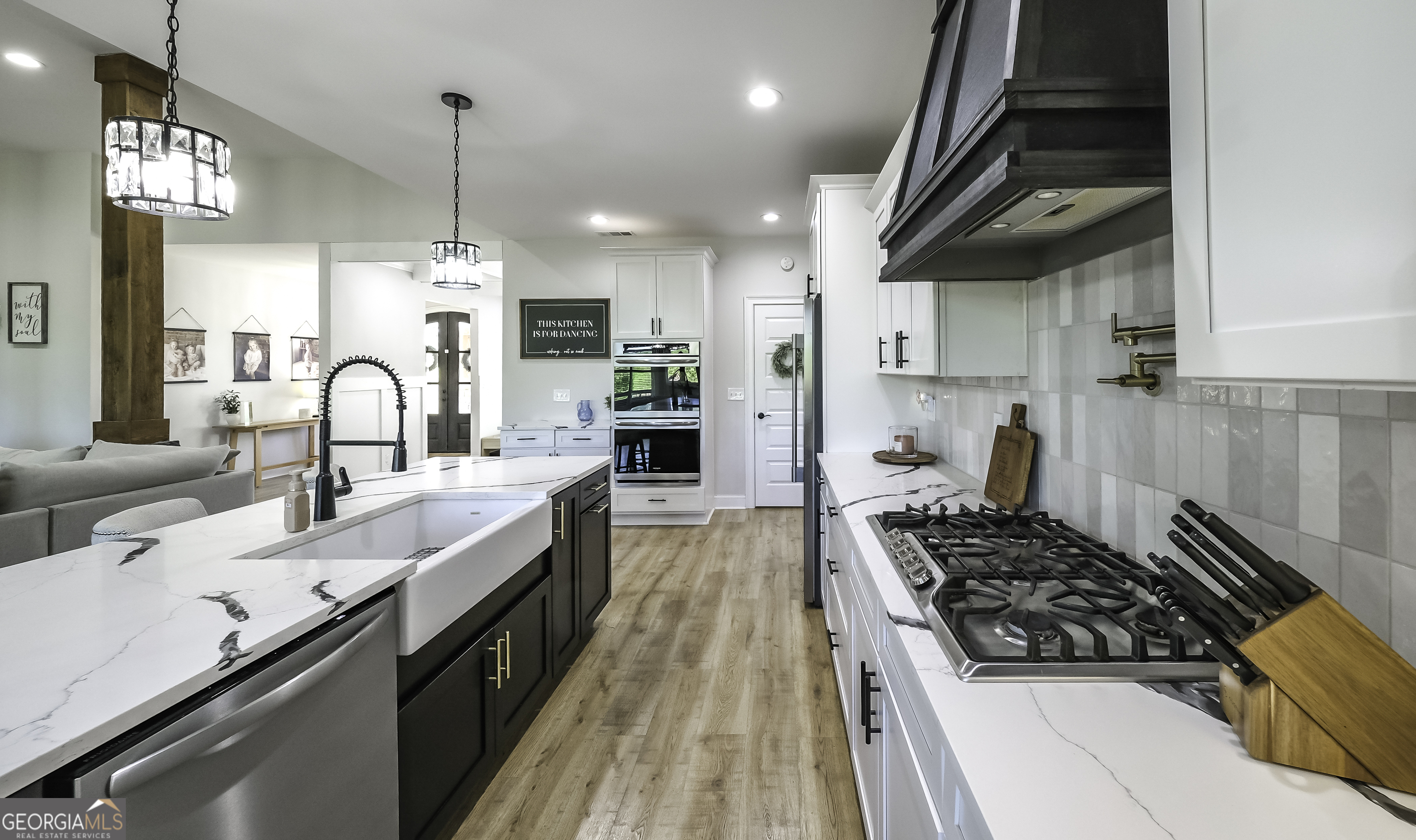 2392 Welcome Road Roopville, GA 30170 - Photo 10 of 43 a kitchen with stainless steel appliances a sink stove and cabinets