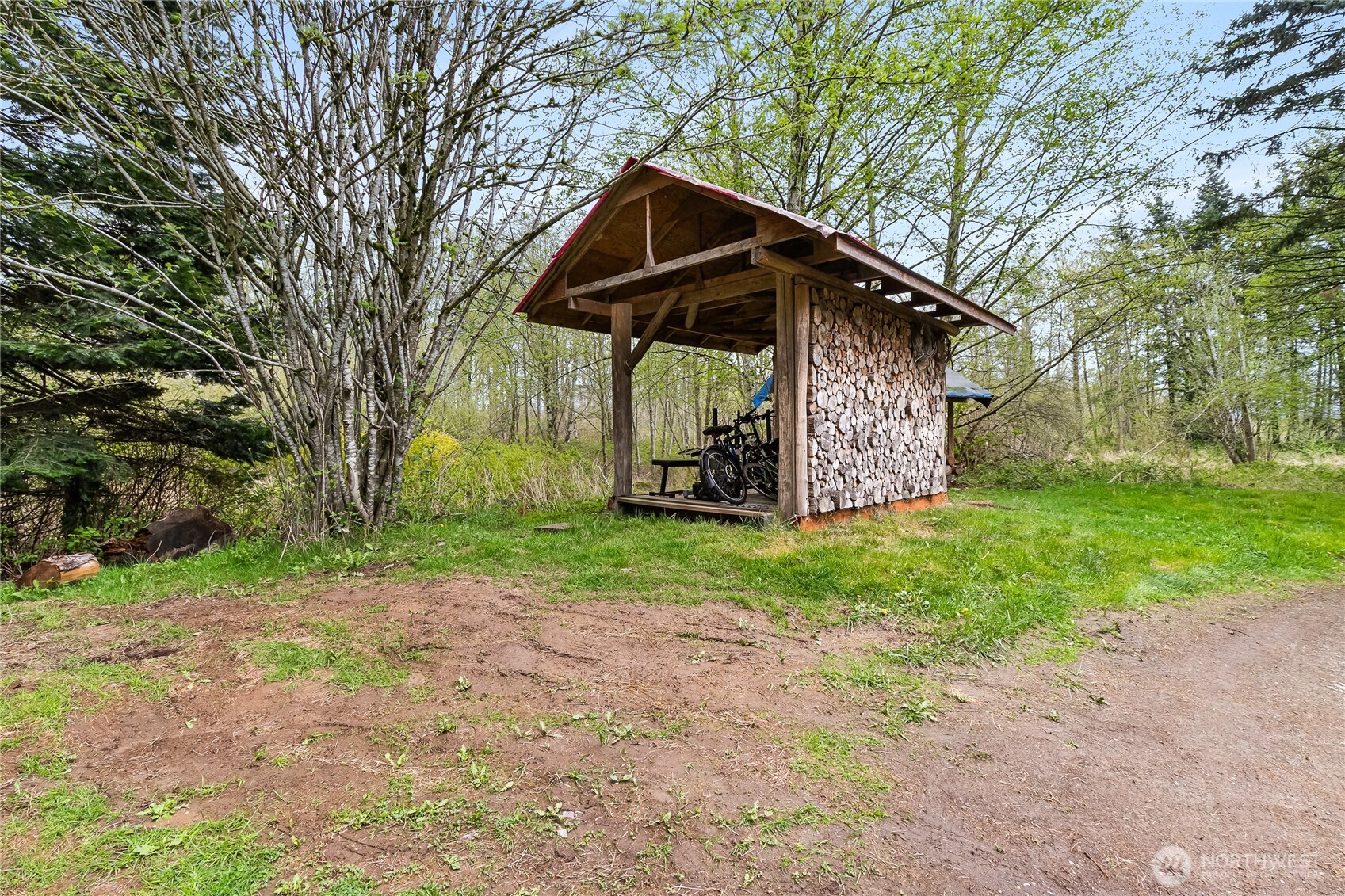 6557 Malloy Road Ferndale, WA 98248 - Photo 16 of 24 a view of a wooden house with a yard