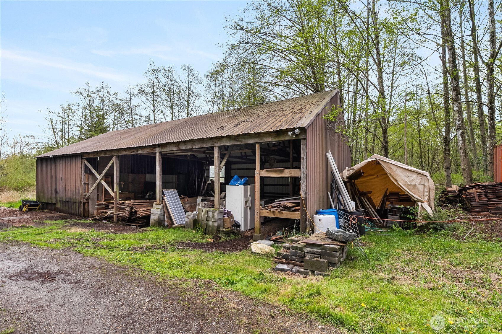 6557 Malloy Road Ferndale, WA 98248 - Photo 19 of 24 a view of a backyard with a sitting area and slide