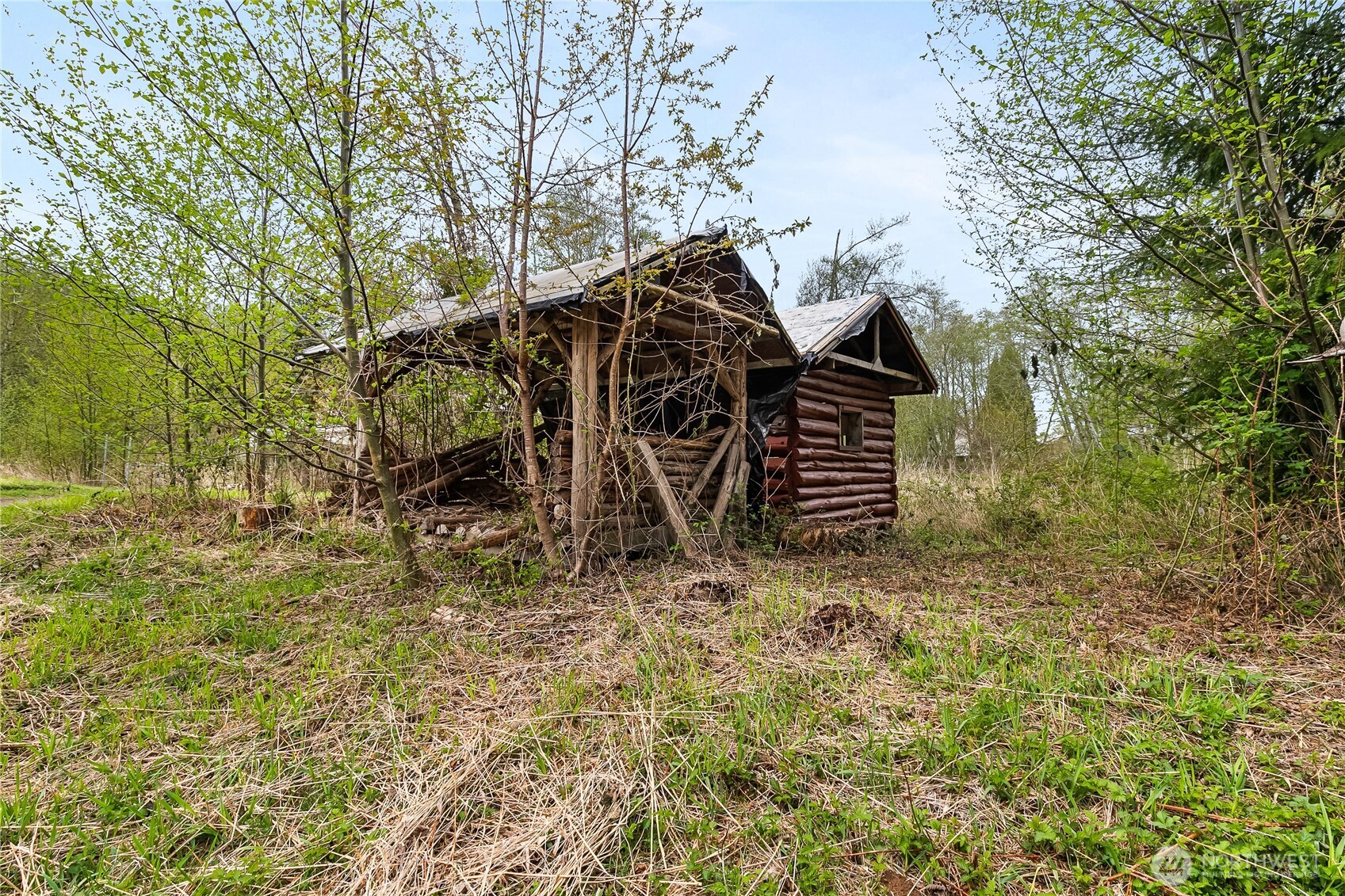 6557 Malloy Road Ferndale, WA 98248 - Photo 22 of 24 a view of a wooden house with a yard