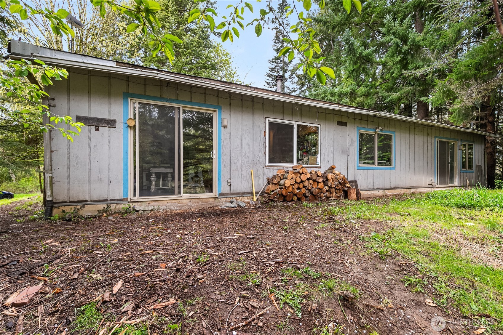 6557 Malloy Road Ferndale, WA 98248 - Photo 3 of 24 a house with trees in front of it