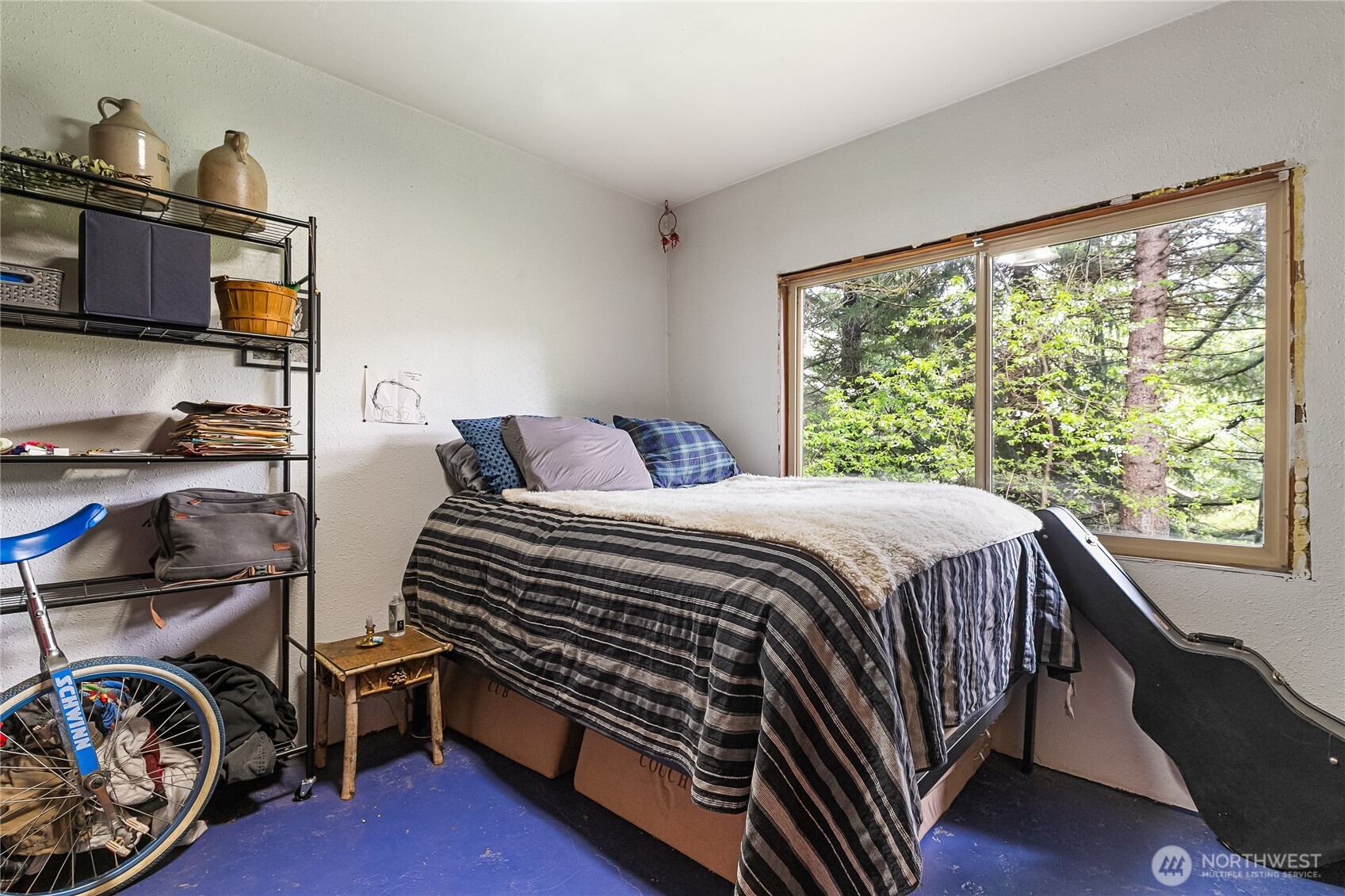 6557 Malloy Road Ferndale, WA 98248 - Photo 8 of 24 a bedroom with a bed and a tv on table
