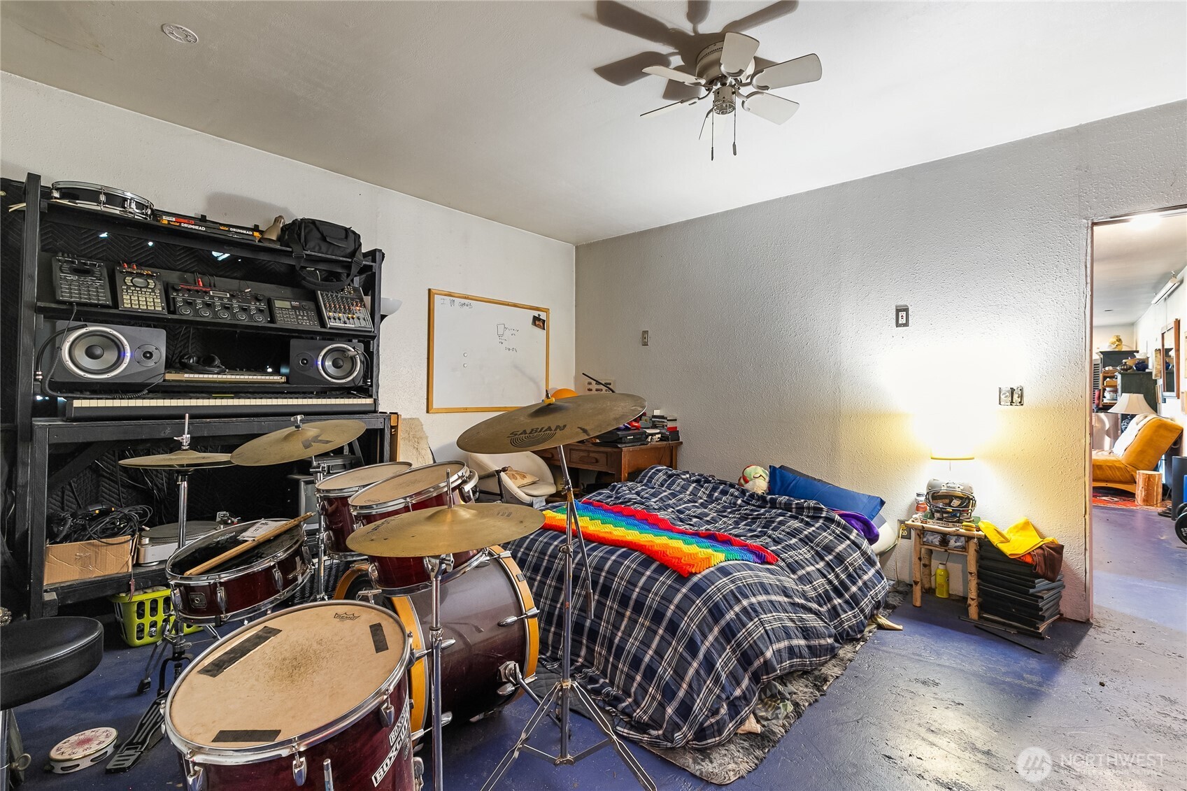 6557 Malloy Road Ferndale, WA 98248 - Photo 10 of 24 a bedroom with bed and a chandelier