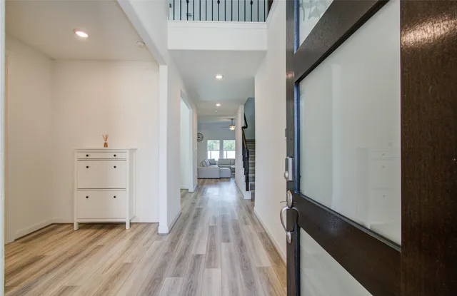 wooden floor in a hall with an entryway