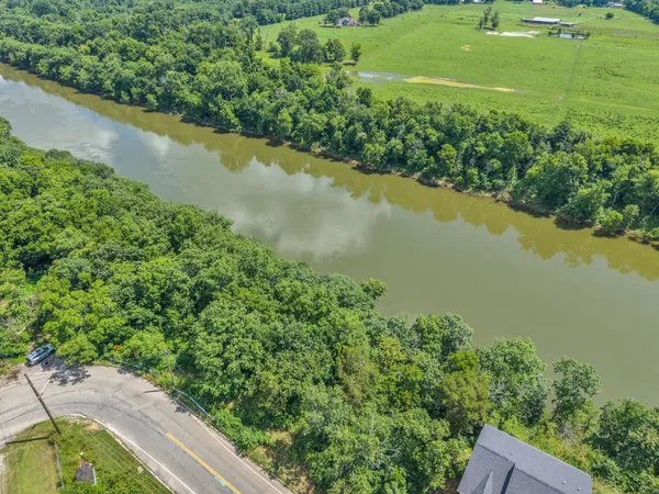 a view of a lake with a yard