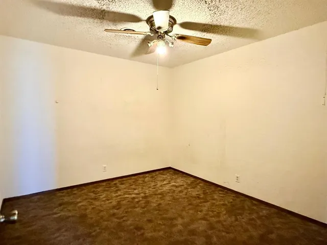 a view of a room with a fan