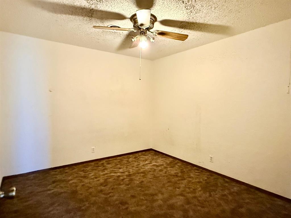 1954 East Booth Street Paris, TX 75460 - Photo 7 of 11 a view of a room with a fan