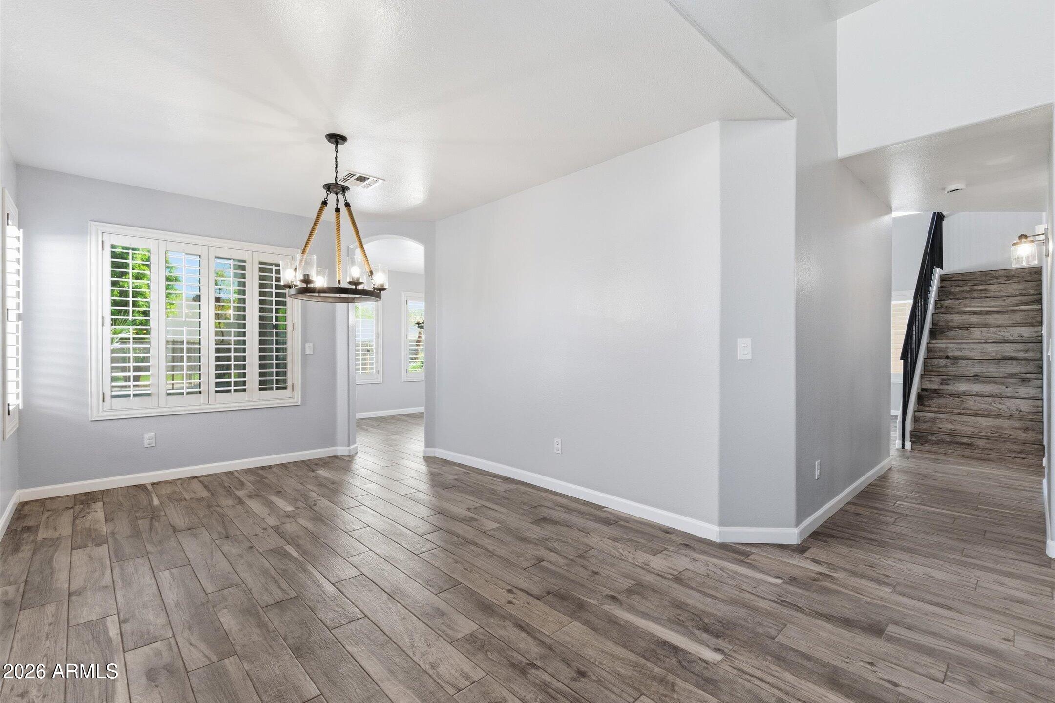 13633 South 47th Street Phoenix, AZ 85044 - Photo 12 of 37 wooden floor in an empty room with a window