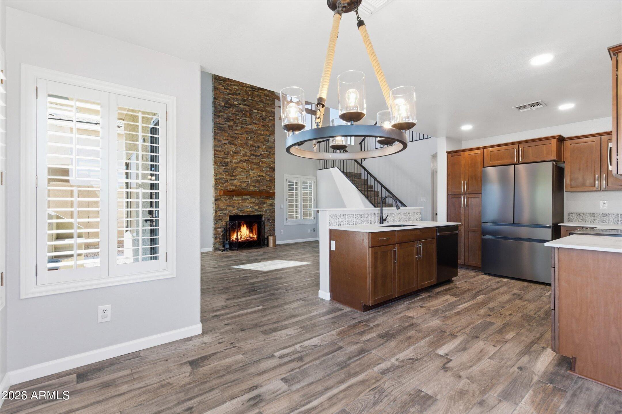 13633 South 47th Street Phoenix, AZ 85044 - Photo 13 of 37 a view of a room with wooden floor and staircase