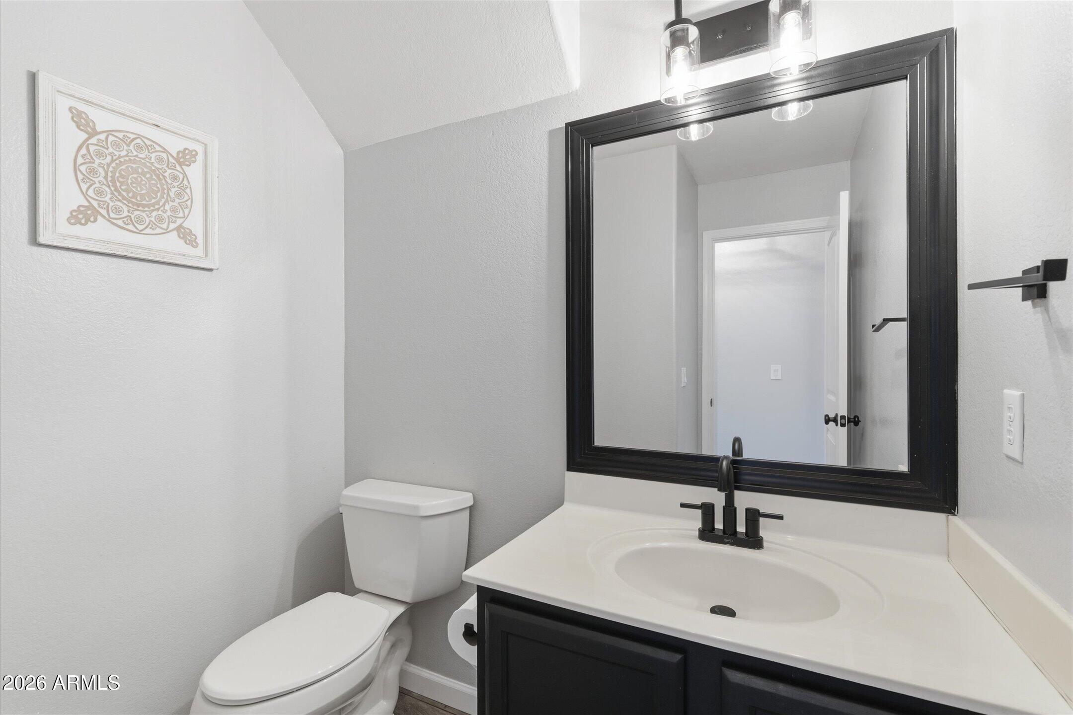 13633 South 47th Street Phoenix, AZ 85044 - Photo 20 of 37 a bathroom with a sink a toilet and mirror
