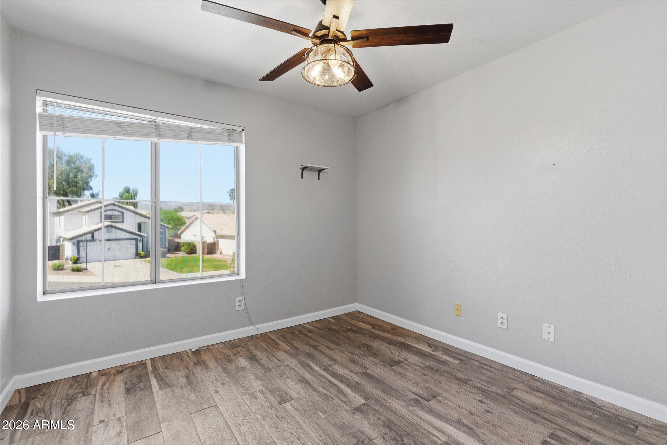 13633 South 47th Street Phoenix, AZ 85044 - Photo 26 of 37 wooden floor in an empty room with a window