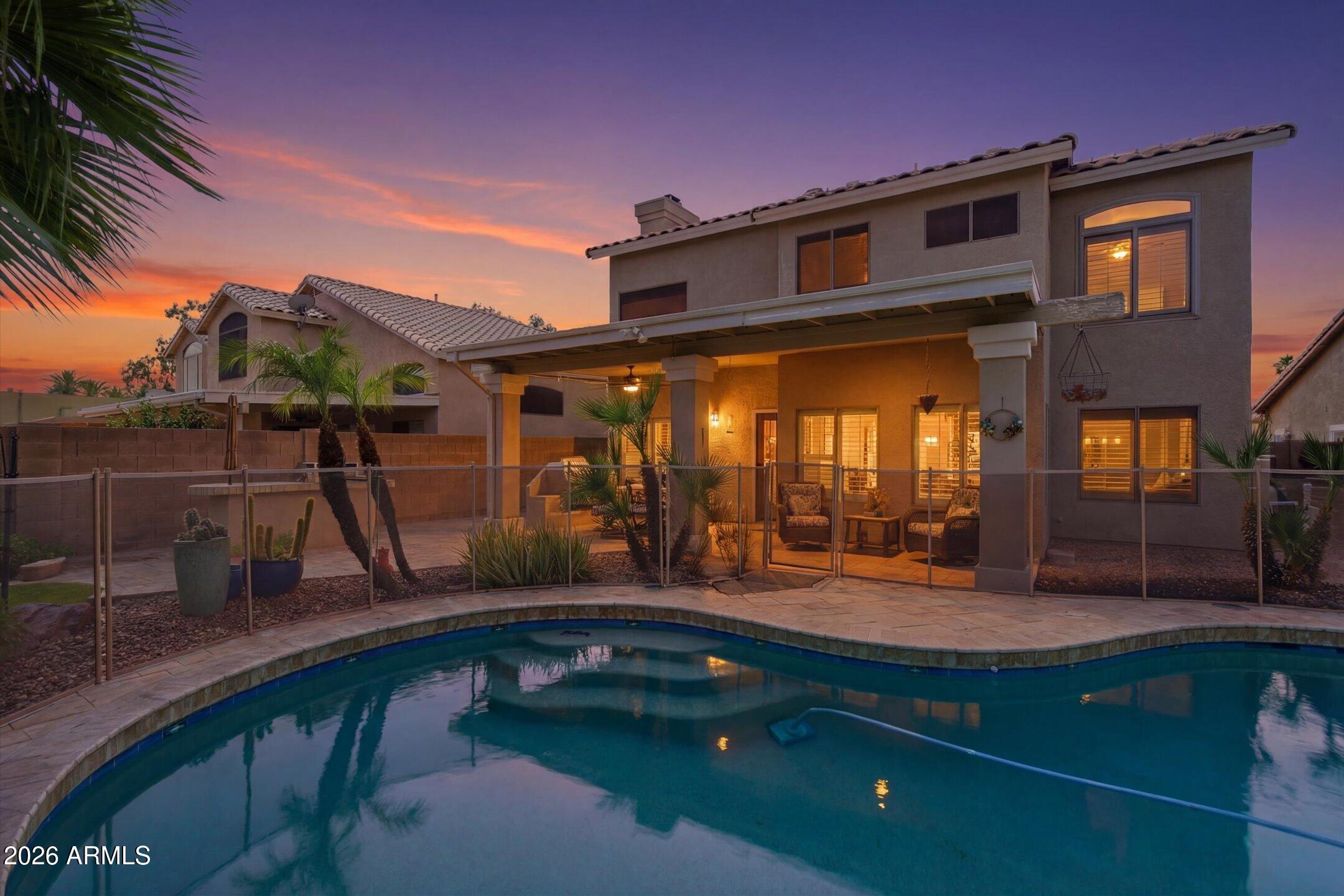 13633 South 47th Street Phoenix, AZ 85044 - Photo 6 of 37 a view of a house with pool and chairs