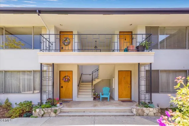 a view of front door with wooden floor