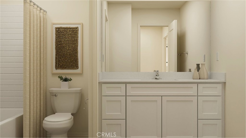 1123 Thunderchief Lane Rialto, CA 92376 - Photo 7 of 20 a bathroom with a toilet a sink and mirror